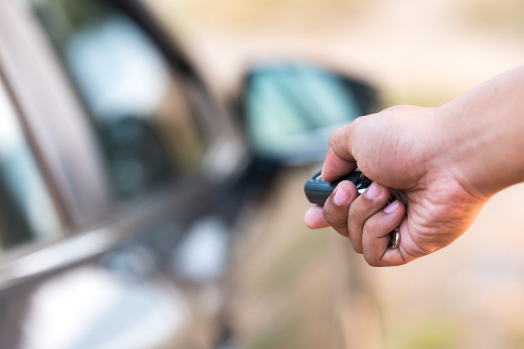 Man holding keys preparing for international car shipping from Australia