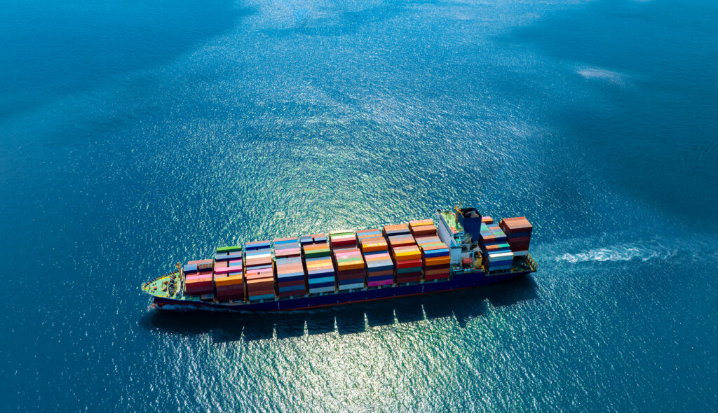 Top-down view of a container vessel at sea, highlighting full container load shipping used in international sea freight.