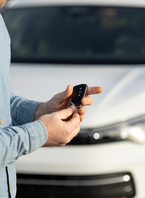 Handing over car keys in preparation for shipping vehicle from australia to new zealand