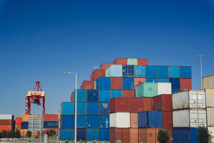 View of a dockyard in Perth with lots of shipping containers containing japanese car imports for australia