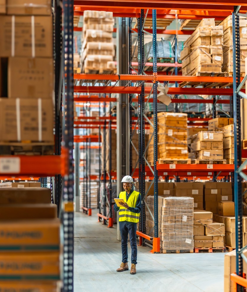 Man standing in warehouse for sea freight NZ to UK